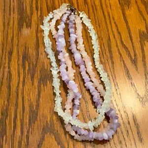 Multi colored quartz three stranded necklace and is 18 inches, excellent shape.